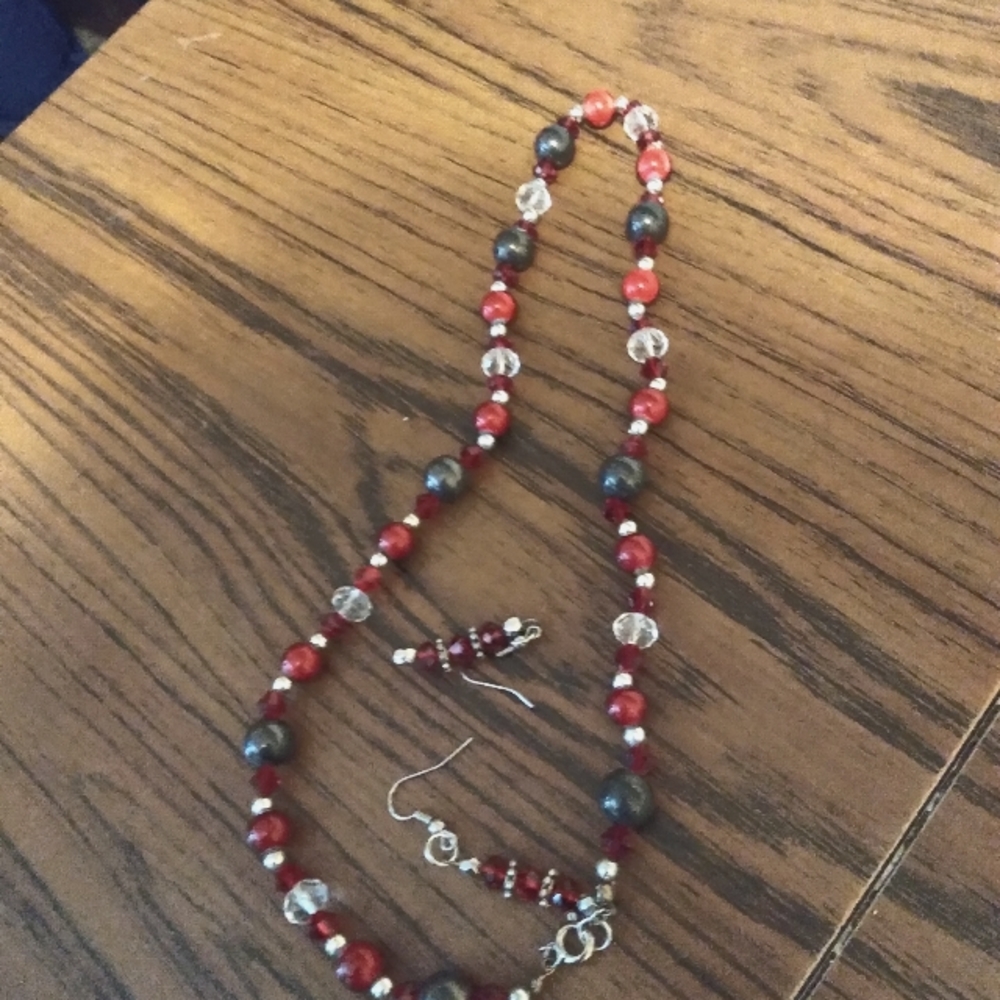 Artisan necklace and earrings. Red and black stone's made with pure nickel.
